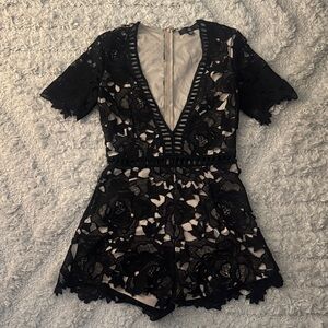 Black Lace Romper with Deep V-Neck